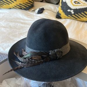 Beautiful slate blue fedora hat with detailed feathered brim. Fall & winter must
